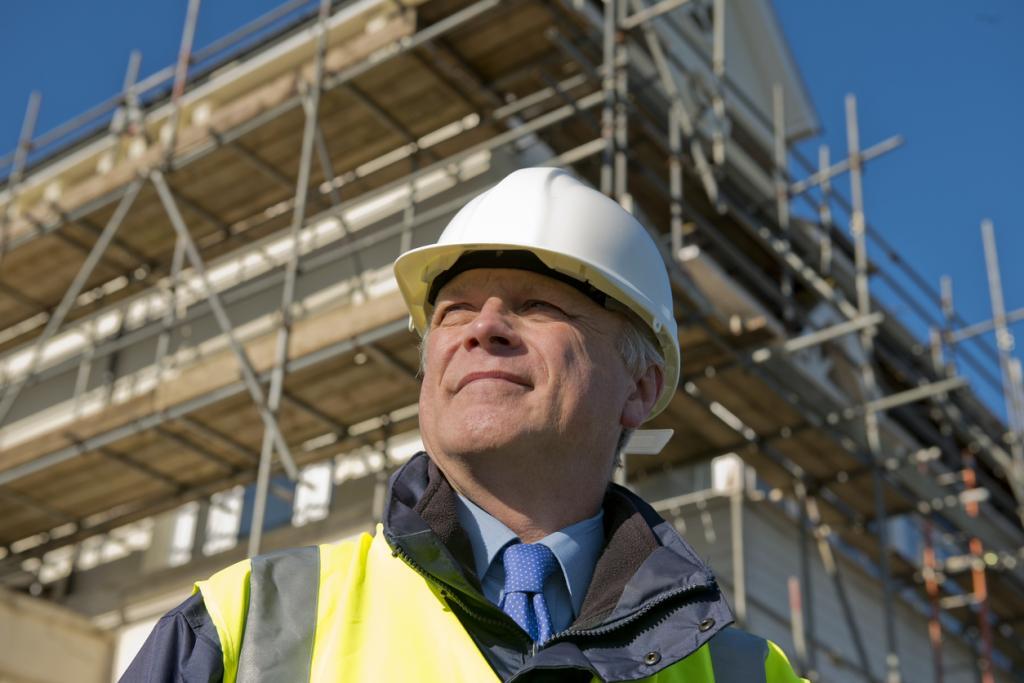 Goed Werkgeverschap - bouwvakker kijkt vooruitstrevend uit zijn ogen